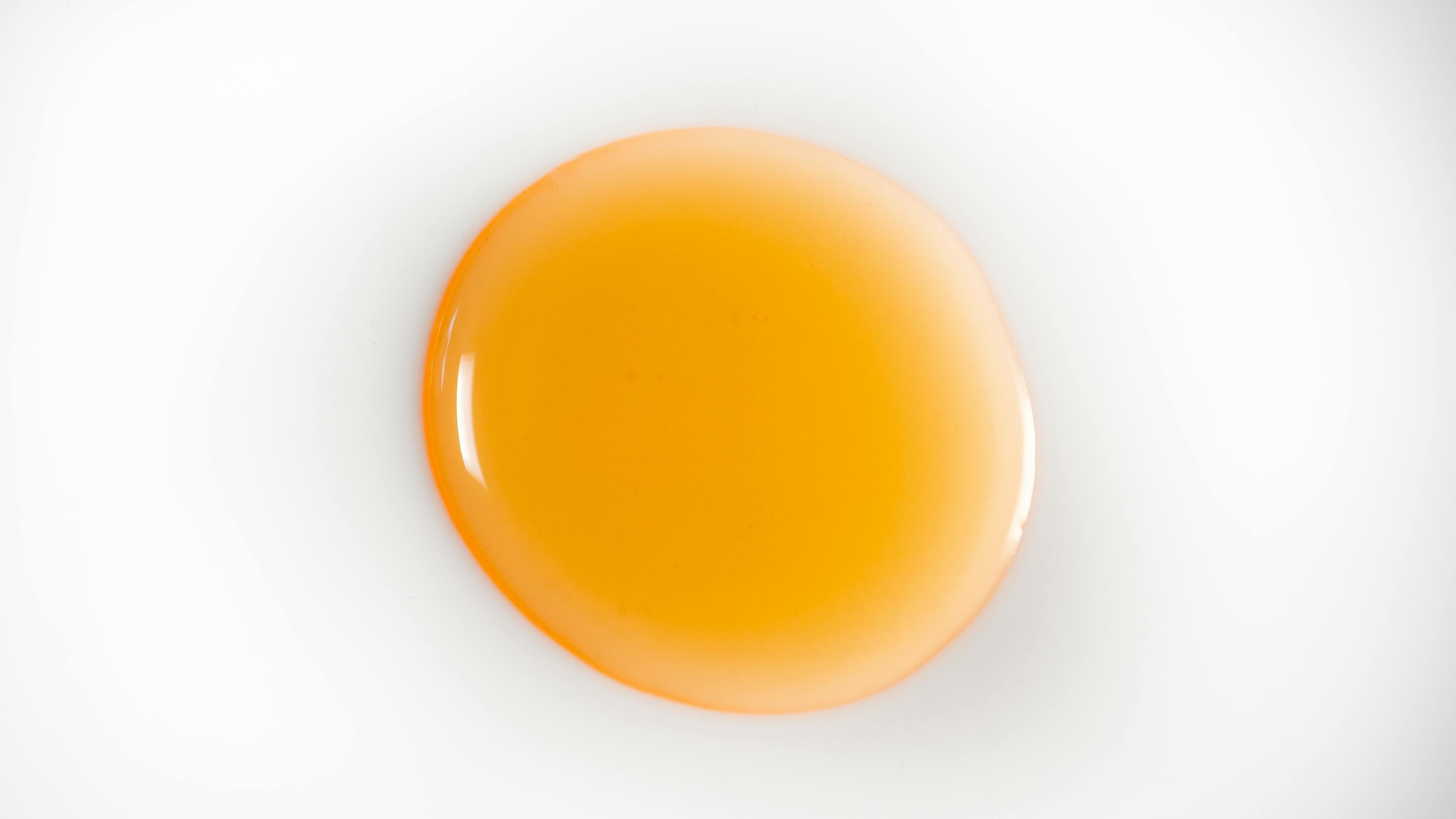 Orange oil on a white background