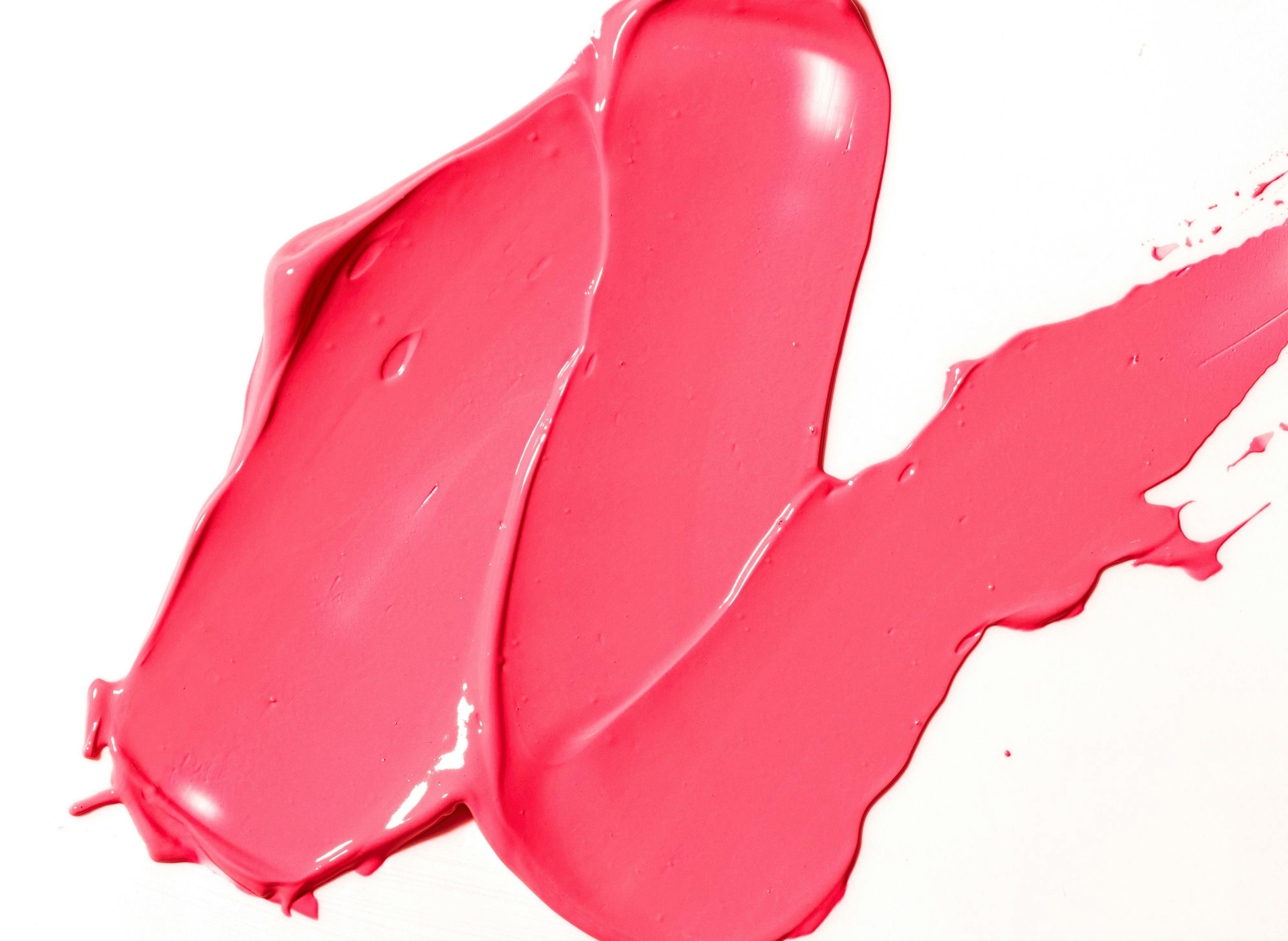Pink putty spread on a white background