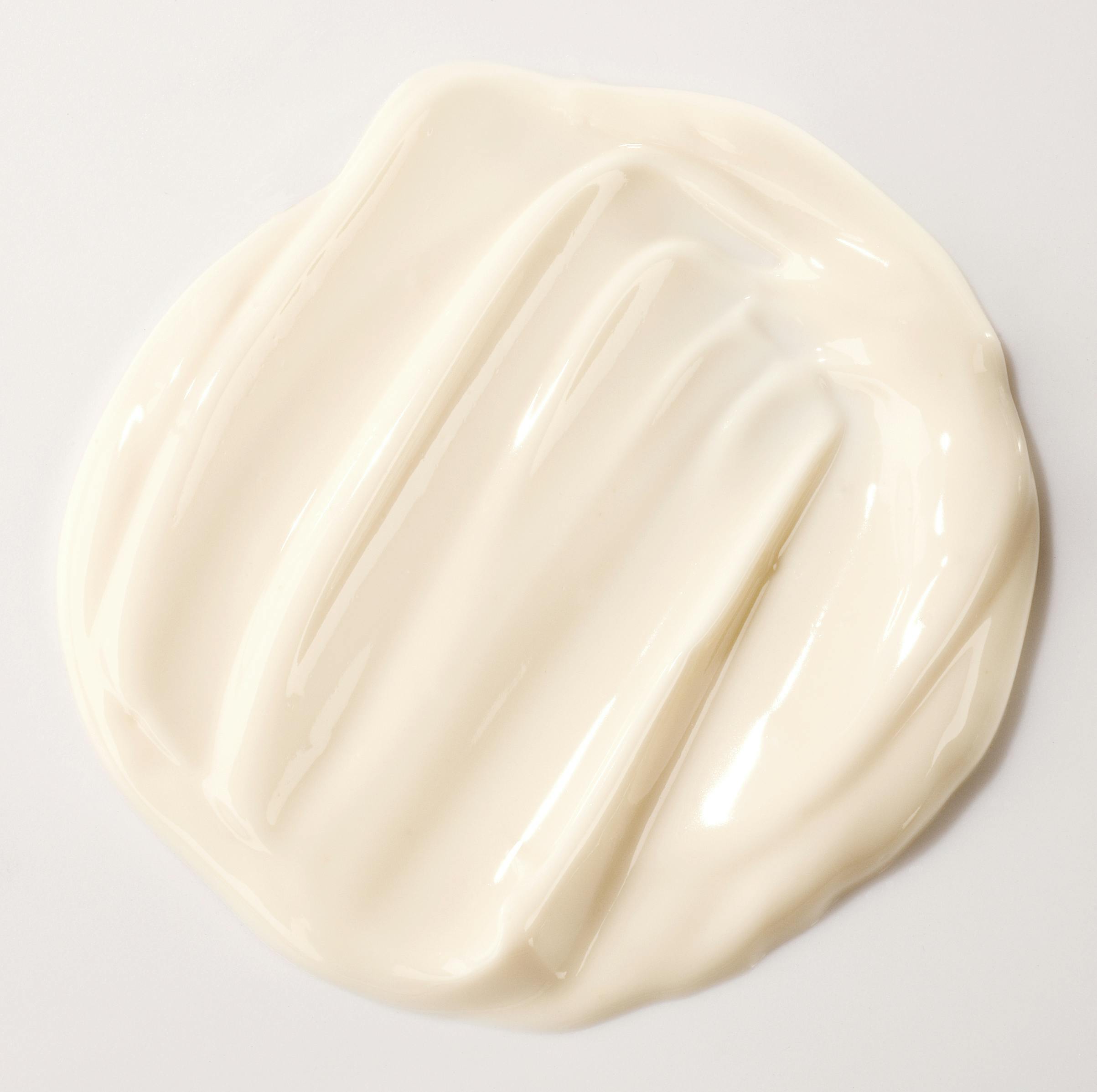 Pale orange cream on a beige background