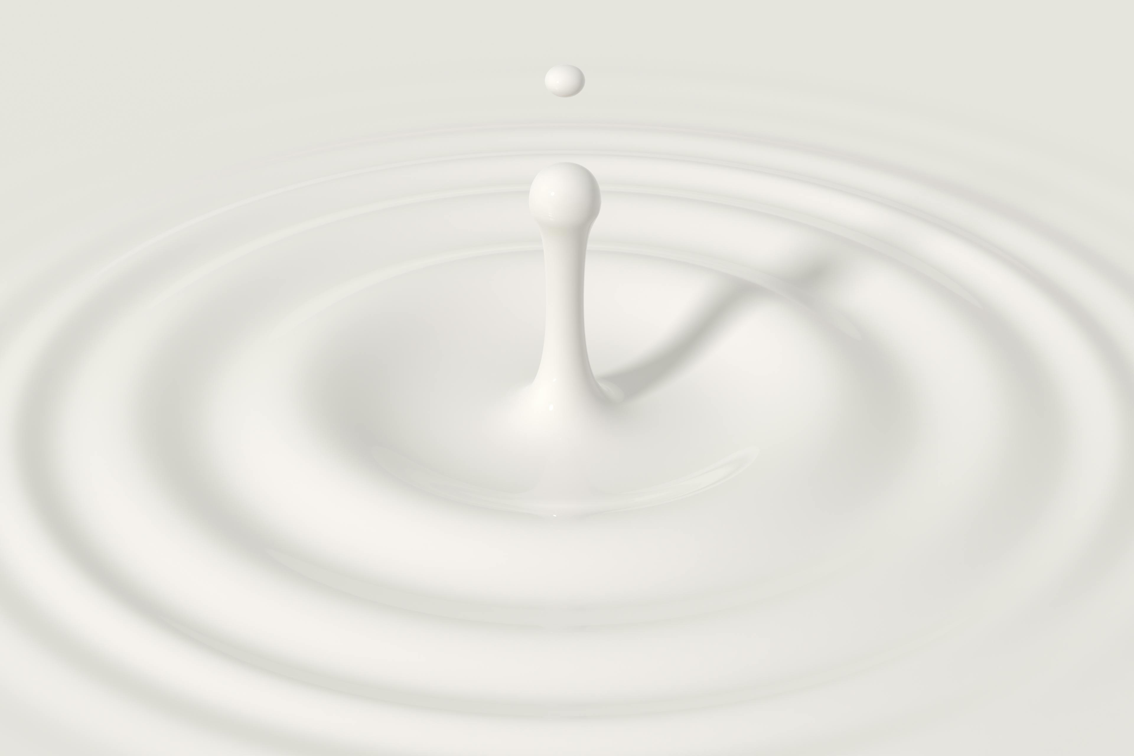 Droplet and ripple in a white liquid