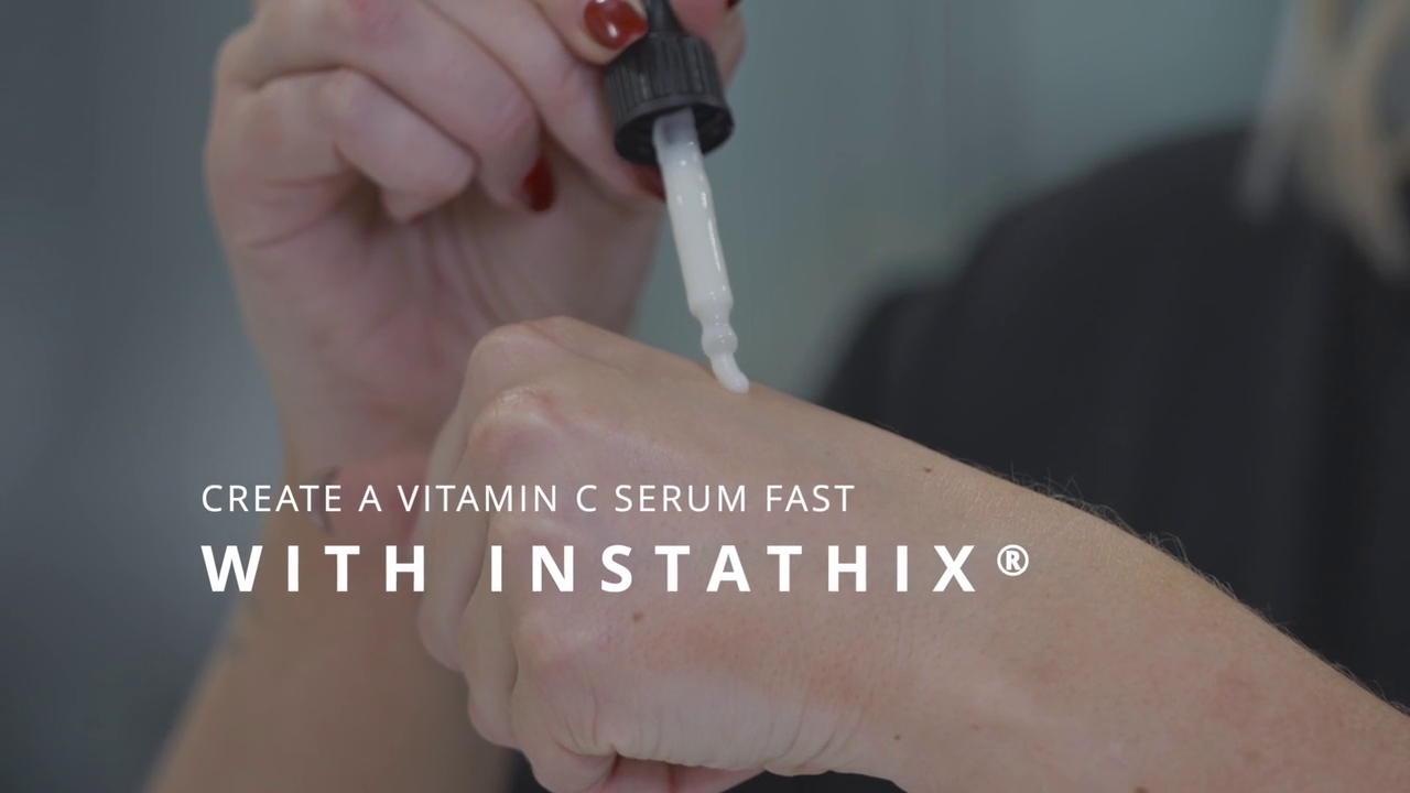 Serum being applied to a hand with the text "Create a vitamin C serum fast with Instathix" written on top